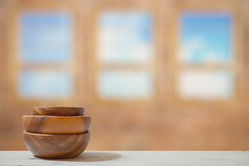 stack of empty wooden bowls on table