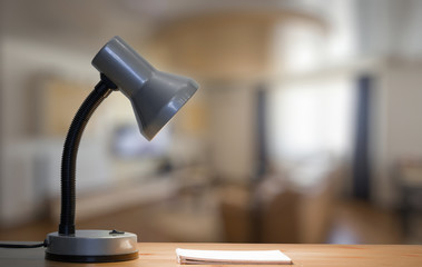 lamp and notebook on table
