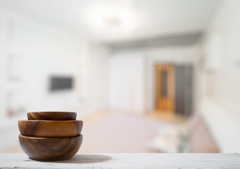 stack of empty wooden bowls on table