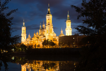 Fototapeta na wymiar view of Cathedral in Zaragoza from Ebro river in evening