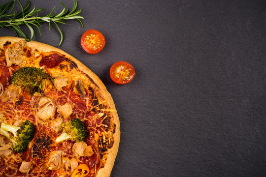 Homemade pizza on slate palte
