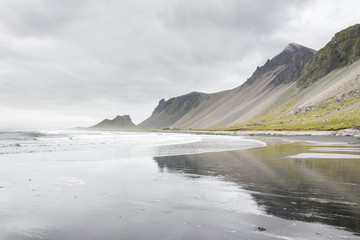 Fototapeta na wymiar Beautiful coast Stokksnes with view to Atlantic ocean and mountains. East of Iceland.