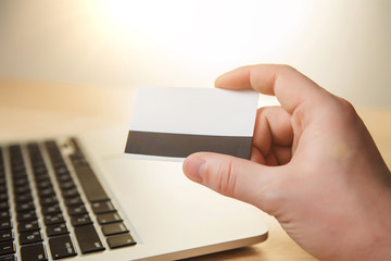 Obraz premium The man doing online shopping with credit card 