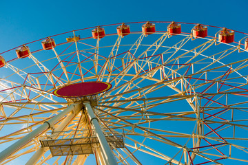 part of a large Ferris wheel on a background of blue sky