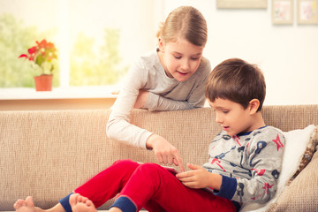 Children playing with tablet pc