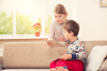 Children playing with tablet pc