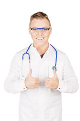 doctor in white coat with stethoscope showing thumbs up sign.Peo