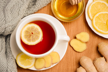 Black tea with lemon, ginger and honey on the wooden table. Horizontal permission. Top view.