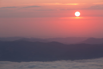 Sunrise over mountains and clouds