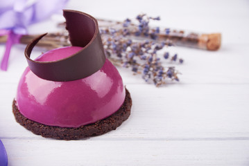 Mini cake with black currant and creamy mousse.