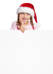 Little girl in Santa hat with white blank