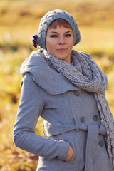 Girl in the meadow in the autumn campaign