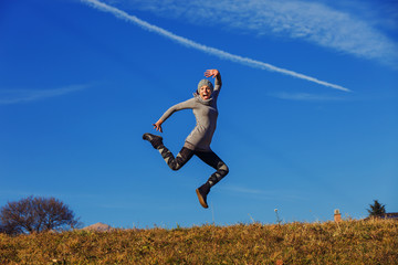 Girl in the meadow in the autumn campaign