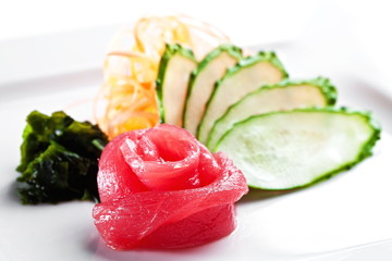 Tuna sashimi with cucumber on a white background 