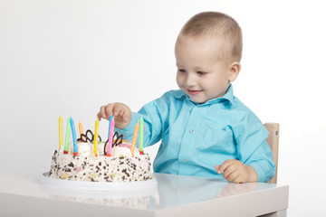 little boy with birthday cake