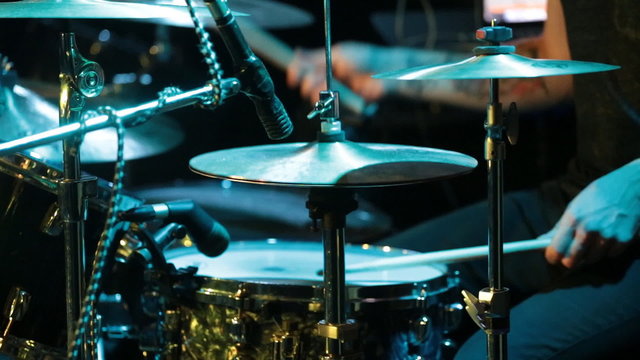 Man playing drums at concert