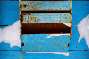 Old mailbox.Blizzard in the city.