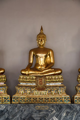 Golden Buddha sculpture in Wat Pho