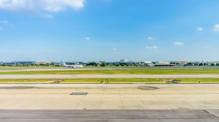 Scenery view of  an airport. It consists of runway, taxiway and apron. © joeyphoto