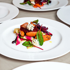 Salad with roasted and fresh vegetables with cream sauce.