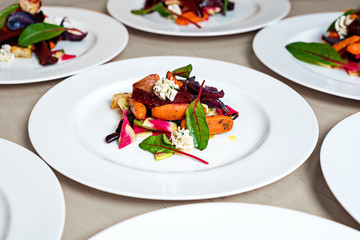 Salad with roasted and fresh vegetables with cream sauce.