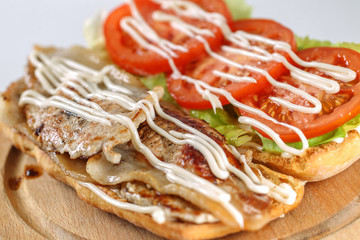 Tasty bacon lettuce tomatoes sandwich in a ciabatta 