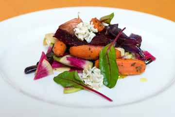 Salad with roasted and fresh vegetables with cream sauce.