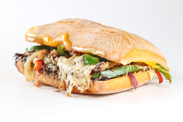 Tasty vegetarian sandwich in a ciabatta on a wodden plate