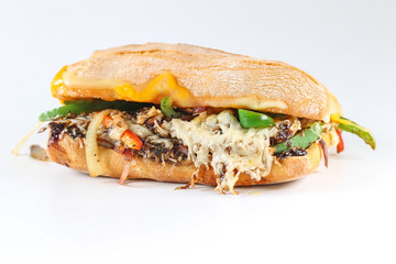 Tasty vegetarian sandwich in a ciabatta on a wodden plate