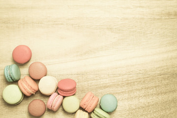 colorful macaroons on wooden background , top view
