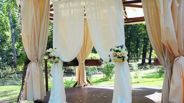 Decoration of the wedding secular  ceremony outdoor. Banquet in the summer hot sunny day