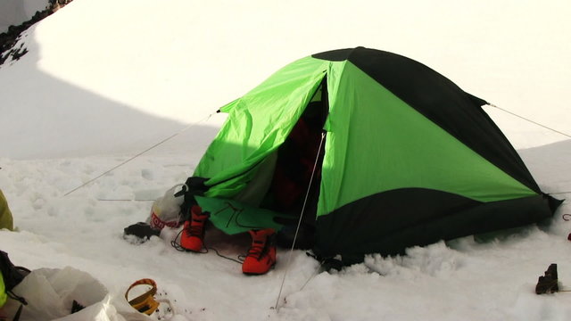 Camp of climbers in the high mountains. Altay, Russia, Maashey-Bashi mountain, North Chui range, altitude 4000 m. 
