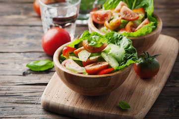 Concept of healthy food: salad with tomato and cucumber