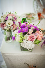 Beautiful wedding reception table arrangement, tableware and whi