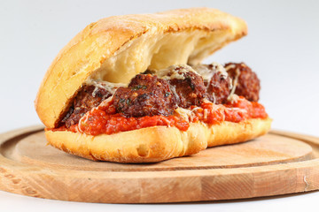 Tasty meatballs sandwich in a ciabatta with tomato sauce and parmesan