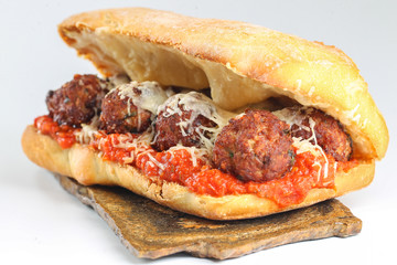 Tasty meatballs sandwich in a ciabatta with tomato sauce and parmesan