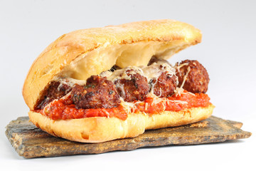Tasty meatballs sandwich in a ciabatta with tomato sauce and parmesan