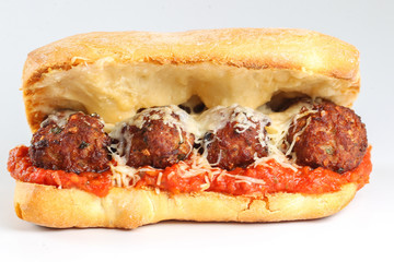 Tasty meatballs sandwich in a ciabatta with tomato sauce and parmesan