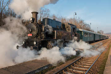 Fototapeta na wymiar Historic Steam Train at railway station