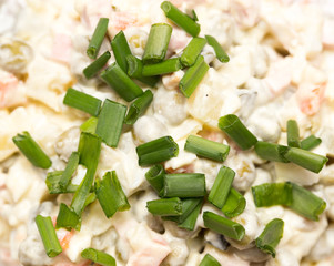 Olivie . salad with mayonnaise as a background