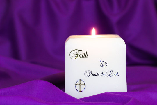 Praise The Lord On Candle With Purple Linen Background