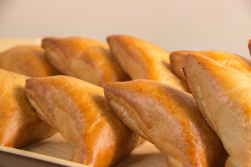 Bakery products. Golden brown cakes, and all Russian belyashi ru