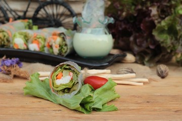 Salad rolls vegetable with tuna and crab stick.