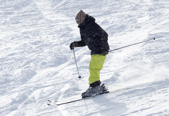 Fototapeta na wymiar Athlete skiing in the snowy mountains