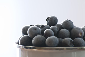 Photo of frozen blueberrys in metal mug