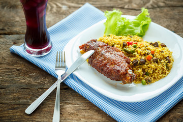 Tasty dishes from turkey meat with rice and salad leaves and a g