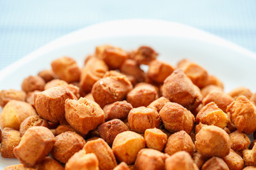 Cookies on a white plate and blue checkered tablecloths