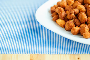 Cookies on a white plate and blue checkered tablecloths