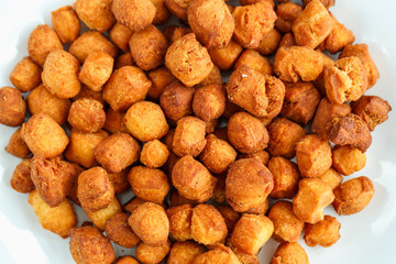 Cookies on a white plate and blue checkered tablecloths