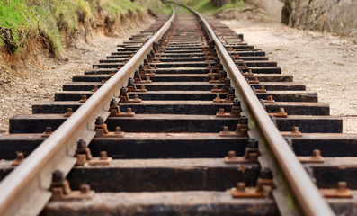 Railway track on sand, low angle view - obrazy, fototapety, plakaty